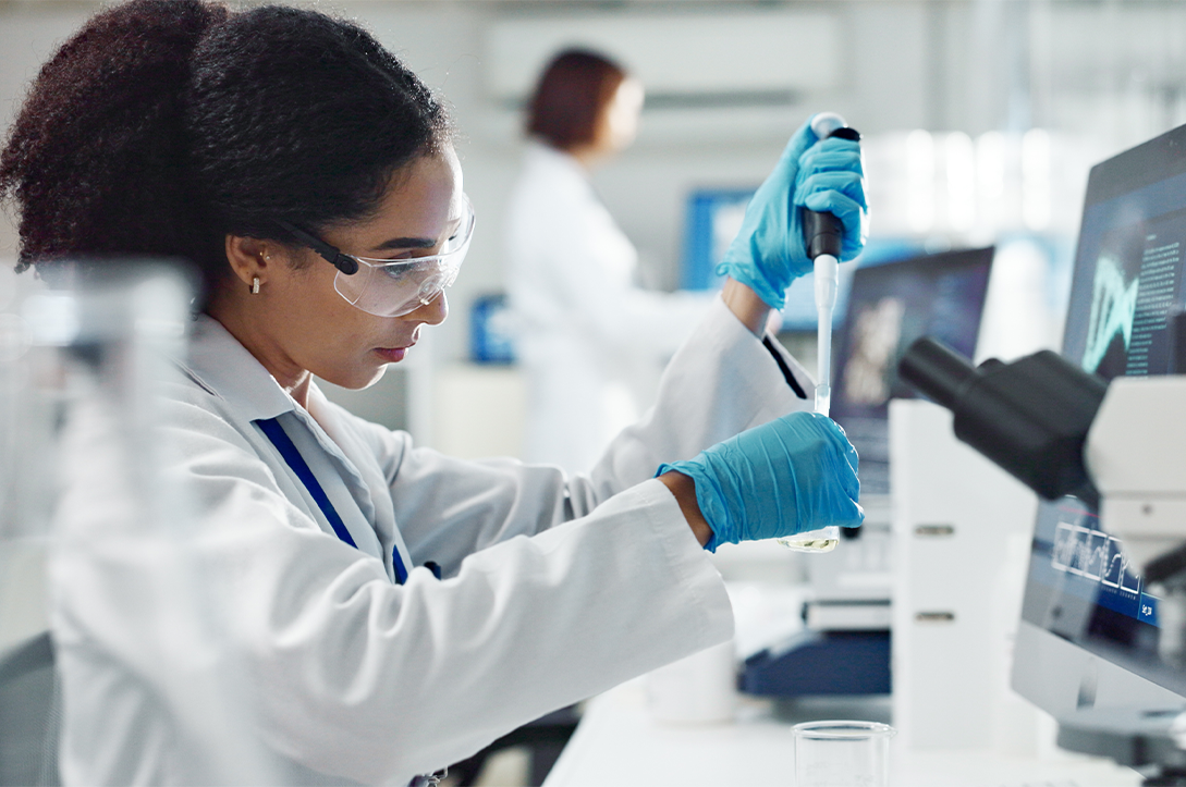 A photo of a woman working in a medical laboratory.